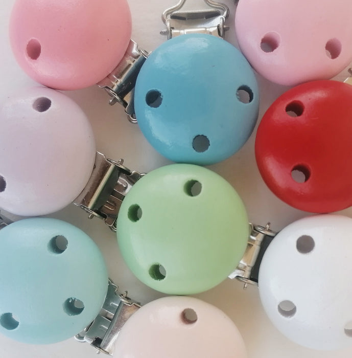 Pinzas para chupetes de madera, varios colores